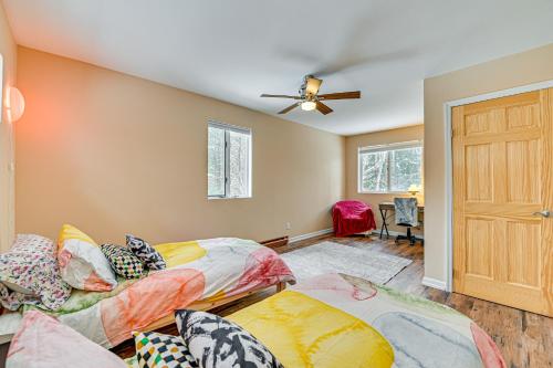 a bedroom with two beds and a ceiling fan at Ski, Hike and Golf Pet-Friendly Windham Retreat in Windham