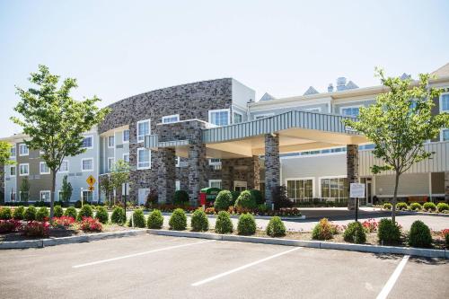 a building with a parking lot in front of it at Courtyard by Marriott Philadelphia Springfield in Springfield