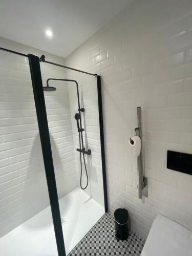a shower with a glass door in a bathroom at Altzoko Ostatua in Aozo