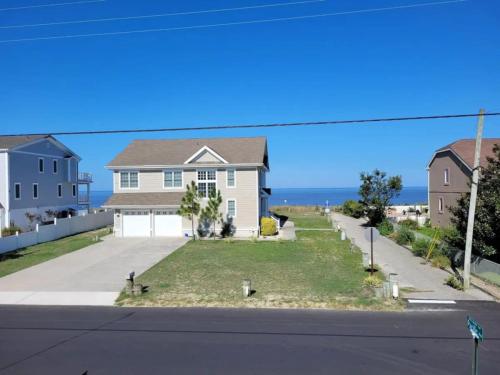 a house with a view of the ocean at Water View Cottage Steps to Beach in Villas