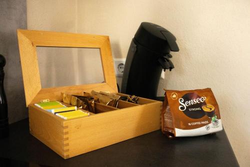a box of stationery on a table with a mirror at Deniz Apartments in Kappel-Grafenhausen
