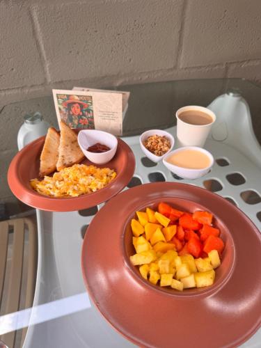 a table with two plates of food on a table at Vida Hostel in Medellín