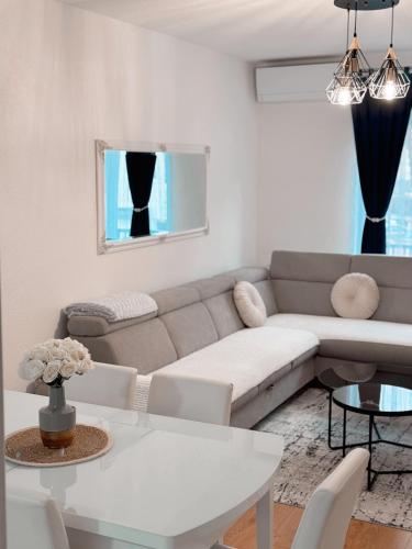 a living room with a couch and a table at Apartment Saturday in Travnik