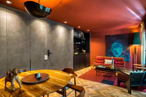 a living room with a table and a couch at El Alfonsa in Mexico City
