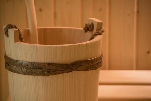 a white vase with a rope wrapped around it at Hotel Koruna in Chlumec nad Cidlinou