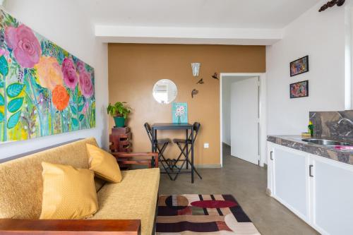 a living room with a couch and a table at The garden gate resort & Apartments No 02 in Negombo