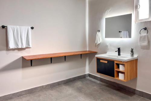 a bathroom with a sink and a mirror at CASA LUGO mx in El Porvenir