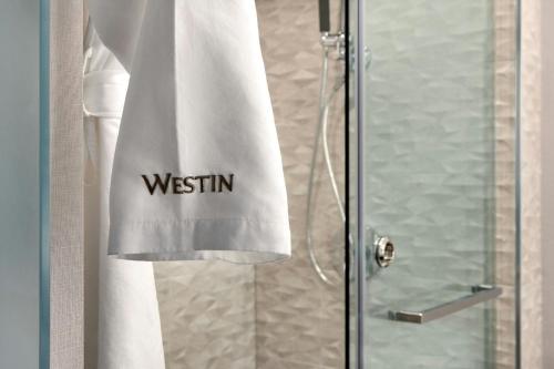 a shower curtain with the words wisdom written on it at The Westin Harbour Castle, Toronto in Toronto