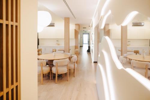 a dining room with tables and chairs at Forest Retreat Center in Kyiv