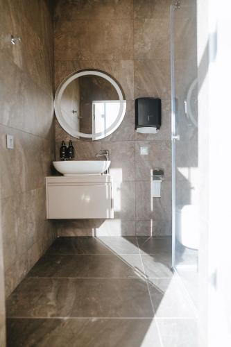 a bathroom with a sink and a mirror at Forest Retreat Center in Kyiv