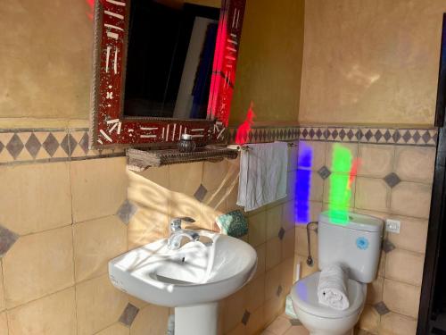 a bathroom with a sink and a toilet at Kasbah Tifirte Grand Vallet in Ourika