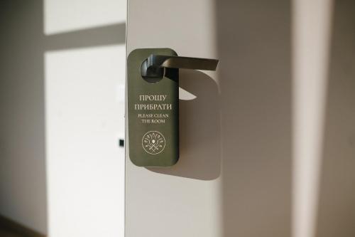 a close up of a door handle on a door at Forest Retreat Center in Kyiv