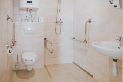 a bathroom with a toilet and a sink at Forest Retreat Center in Kyiv