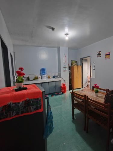 a room with a kitchen with a table and a table sidx sidx at Your home near Burnham Park in Baguio