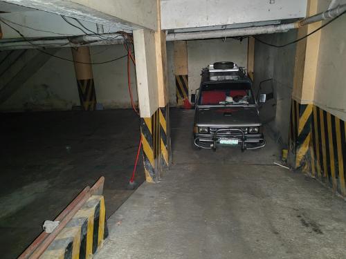 a car is parked inside of a garage at Your home near Burnham Park in Baguio