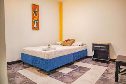 Giường trong phòng chung tại Casa cerca Centro, Salida Parque del Café, Panaca a minutos de Salento y Filandia rentalsOP Q01