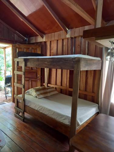 a bedroom with two bunk beds in a cabin at La cabaña de Eugenio in Convento