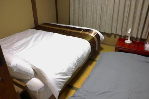 Ein Bett oder Betten in einem Zimmer der Unterkunft Minoya