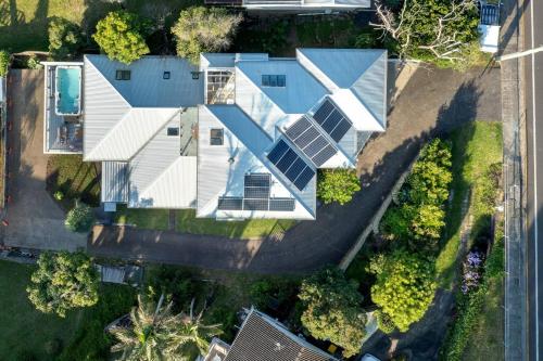 an overhead view of a house with a solar panel on it at Seven Mile View Gerroa in Gerroa