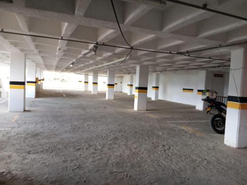 an empty parking garage with a motorcycle parked in it at Hotel Santa Laura in Jericó