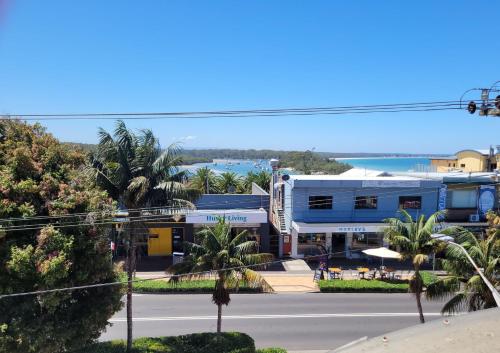 a view of a street in front of a building at Holiday In Husky - 2 Bedroom Apartment located in the centre of town in Huskisson