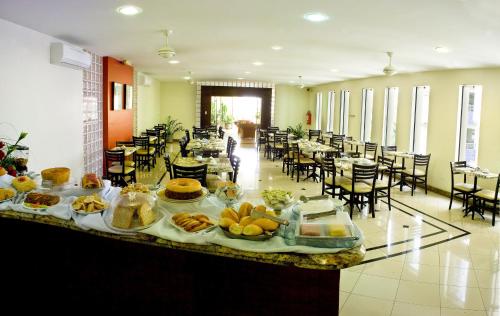 Restoran või mõni muu söögikoht majutusasutuses Benvenuto Palace Hotel