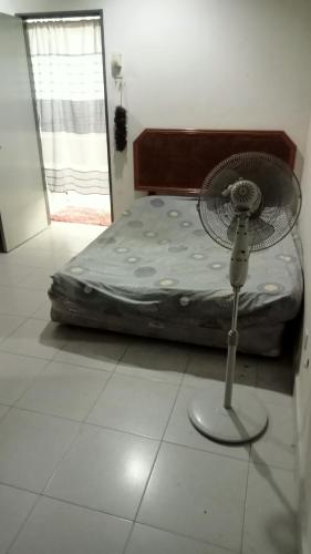 Postel nebo postele na pokoji v ubytování Taman Aman Permai