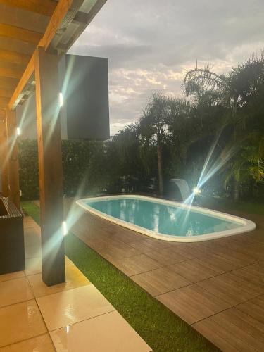 Bazén v ubytování Casa Condomínio Ocean Side Torres nebo v jeho okolí