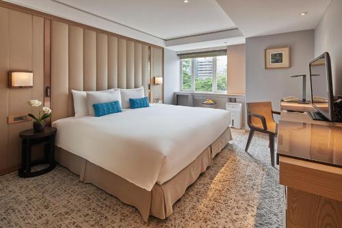 Postel nebo postele na pokoji v ubytování Hotel Royal-Nikko Taipei