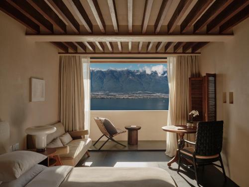 a hotel room with a view of the water at 大理空岛半山海景民宿 in Dali