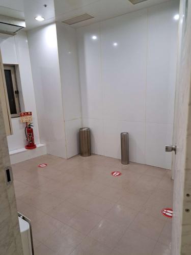 a room with a room with red petals on the floor at Chisun Hotel Hamamatsucho in Tokyo