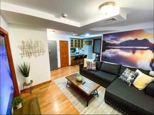 a living room with a couch and a table at La Quinta Loft in Long Island City