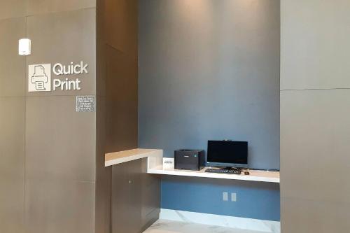 an office with a desk with a computer on it at Courtyard by Marriott Los Angeles Monterey Park in Monterey Park