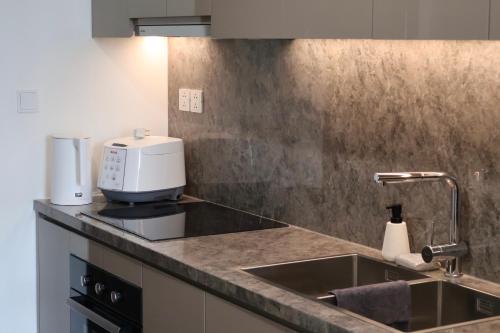 Η κουζίνα ή μικρή κουζίνα στο Giardini Guest House - Masteri WF - H302 - Ocean Park