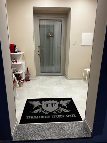 a welcome mat in front of a door at Terraforte Luxury Suite in Fisciano