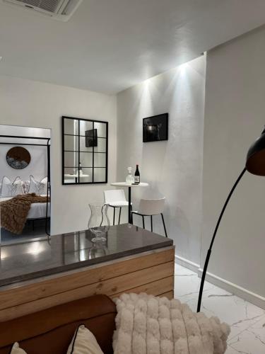 a living room with a mirror and a bed at Luxurious Apartment in Cape Town