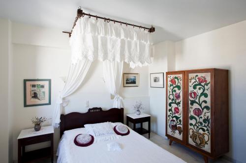 מיטה או מיטות בחדר ב-Chateau Zevgoli