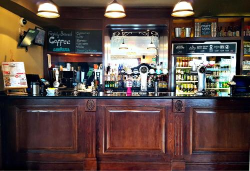 
a kitchen with a large counter top and a large counter top at The Foley Arms Hotel Wetherspoon in Great Malvern
