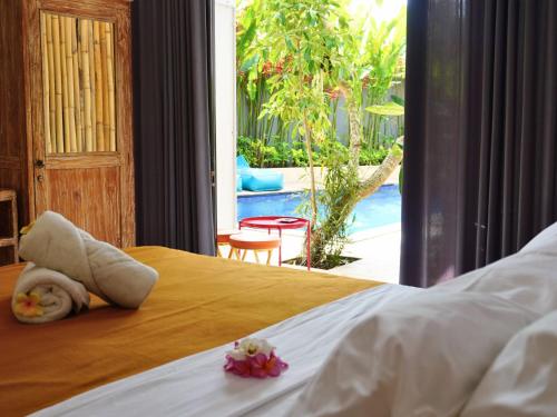 Postel nebo postele na pokoji v ubytování Summer of Surf Hostel Uluwatu