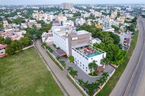 an aerial view of a white building with palm trees at Sterling V Grand Madurai in Madurai