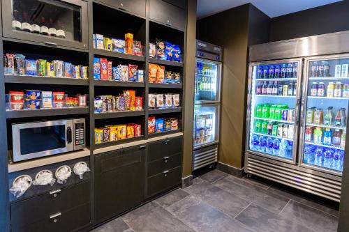 a refrigerator filled with lots of food and drinks at Courtyard by Marriott Lake Jackson in Lake Jackson