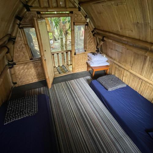 Ένα ή περισσότερα κρεβάτια σε δωμάτιο στο Homestay Syariah Tipe D kadudampit Sukabumi