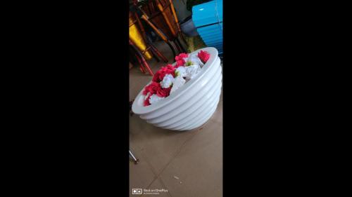 a large white cake with red flowers in it at Grand Serene Hotel - Superior in Ibadan
