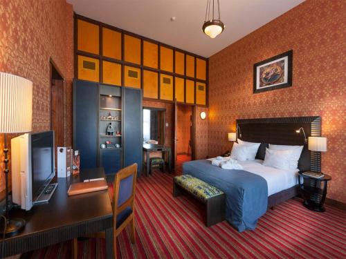 Tempat tidur dalam kamar di Grand Hotel Amrâth Amsterdam