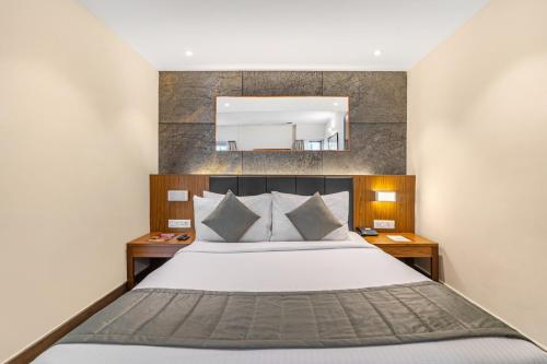 Ein Bett oder Betten in einem Zimmer der Unterkunft Sterling Kodai Valley