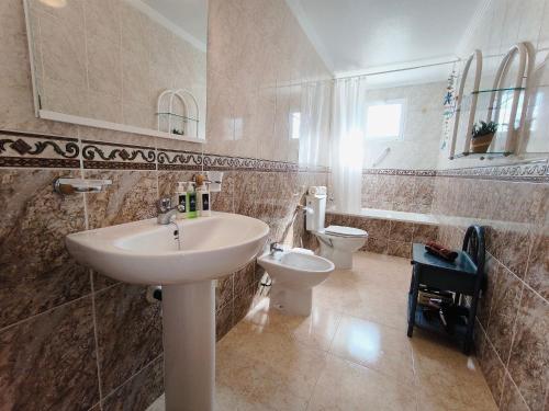 a bathroom with a sink and a toilet at Dream Bungalow with Sea Views at La Mata Beach in Torrevieja