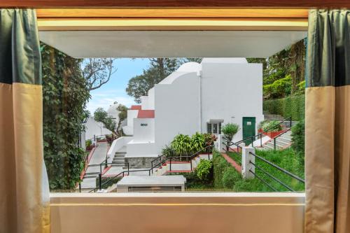 a view through a window of a building at Sterling Yercaud in Yercaud