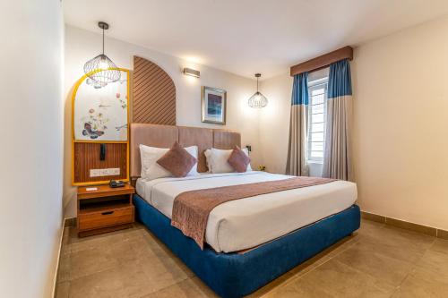 a bedroom with a large bed in a room at Sterling Yercaud in Yercaud