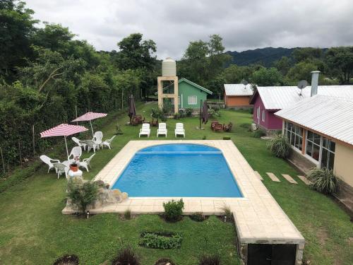an aerial view of a backyard with a swimming pool at WaraKusi Cottages - Off Road in Salta