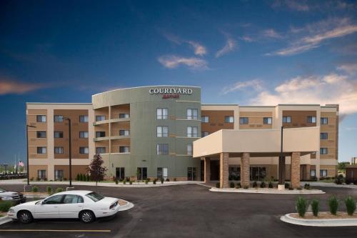 a car parked in a parking lot in front of a hotel at Courtyard Bay City in Bay City